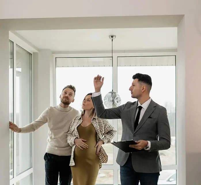 A Summitly advisor showing a couple around a bright home