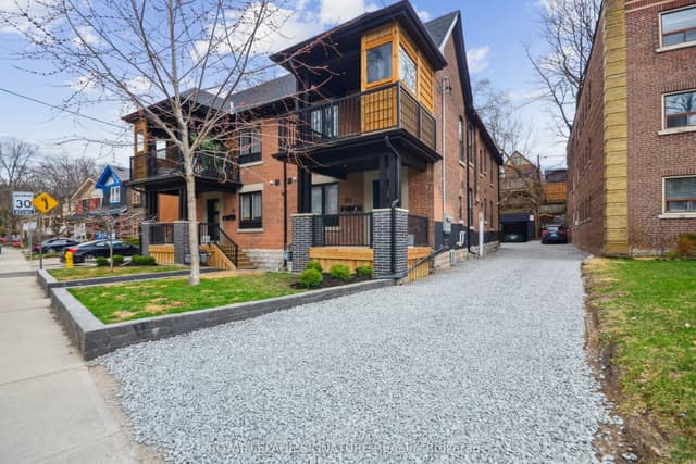 Triplex at 129 Kenilworth Avenue Main, Toronto, ON M4L 3S7, Toronto E02