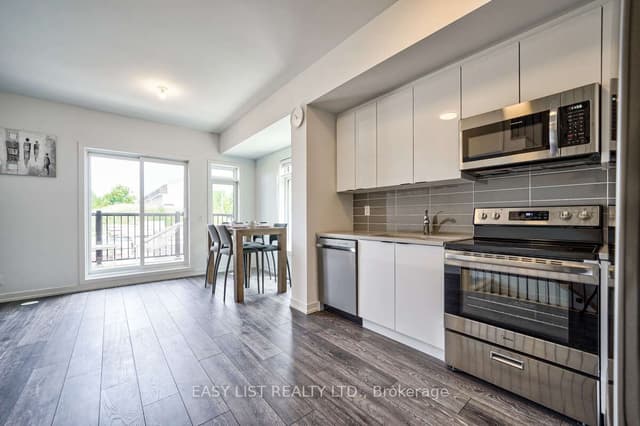 Att/Row/Townhouse at 27 Spruce Pines Crescent, Toronto, ON M4A 0A9, Toronto C13